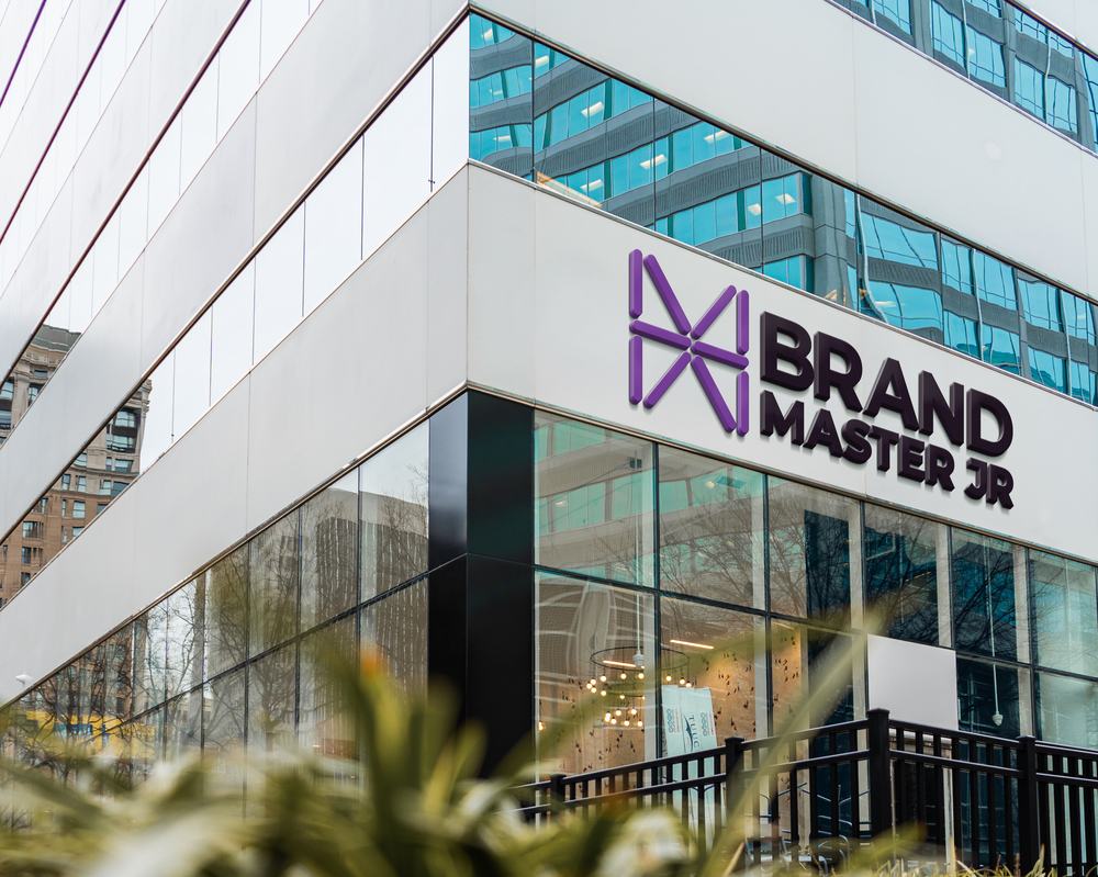 Brand Master Jr. logo signage on a corporate building